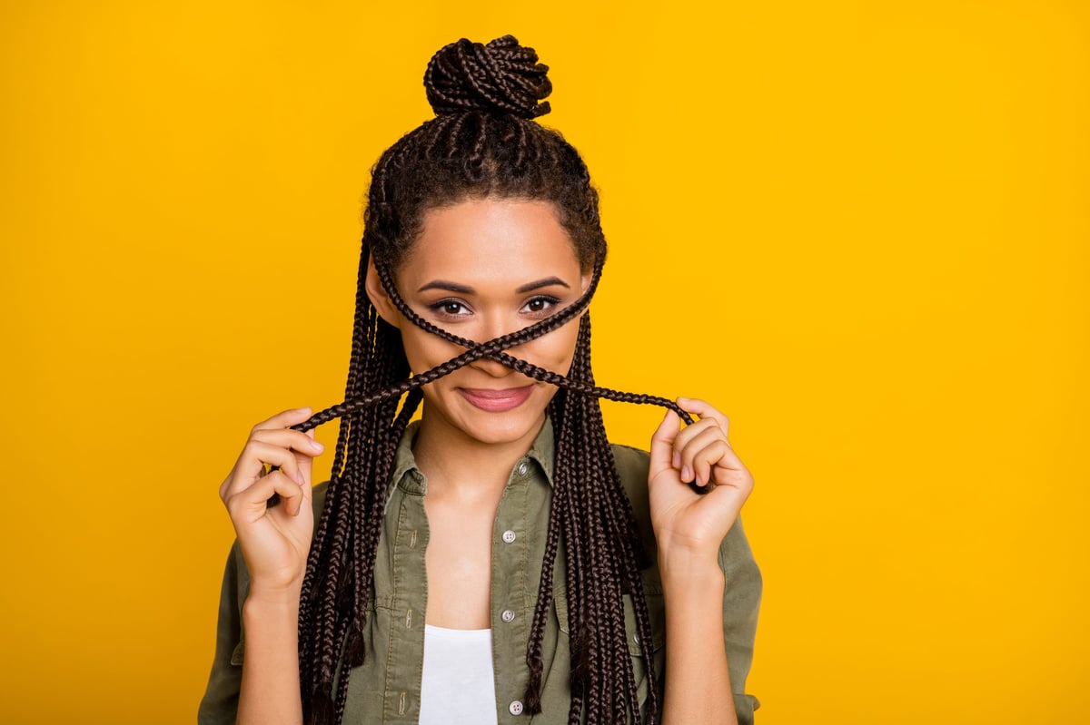 Woman with boho braids and loose curls for a textured look