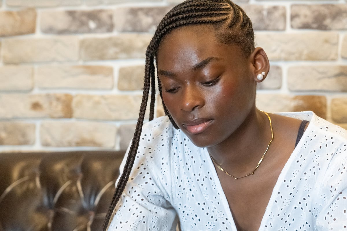 Woman with African braids hairstyle styled at Braids by Favor